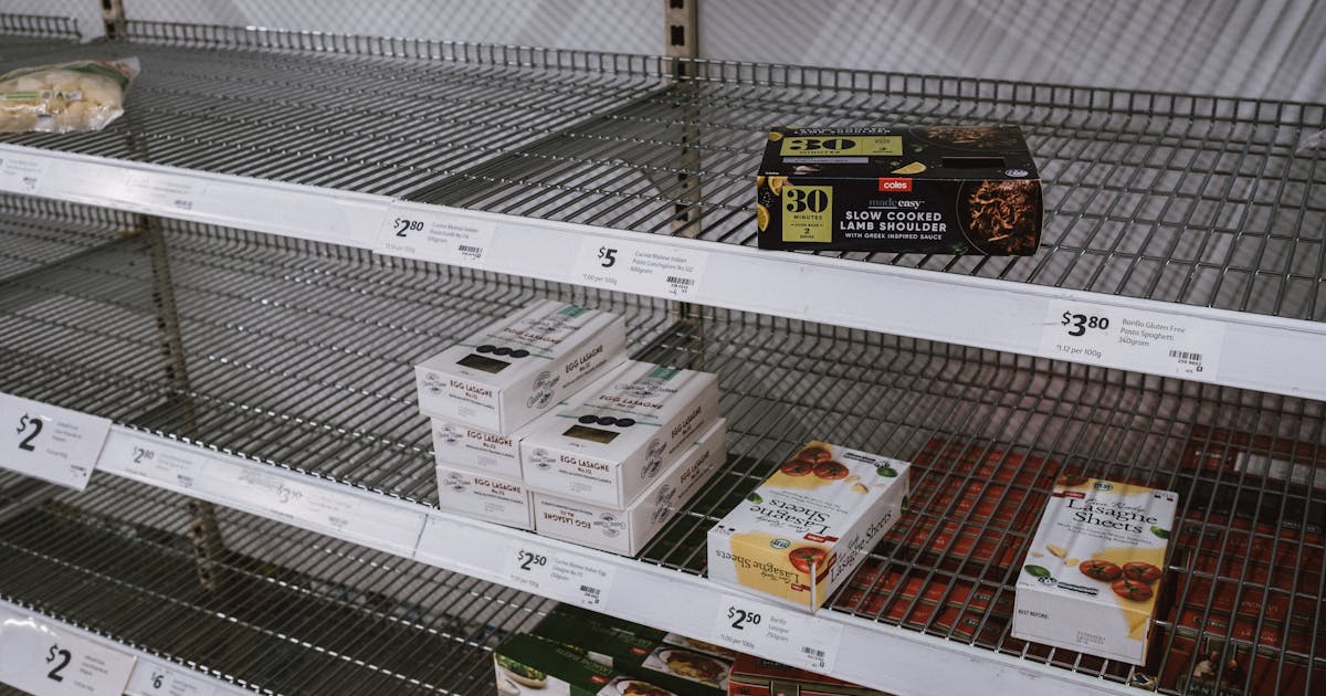 Nearly empty grocery store shelves representing food access challenges