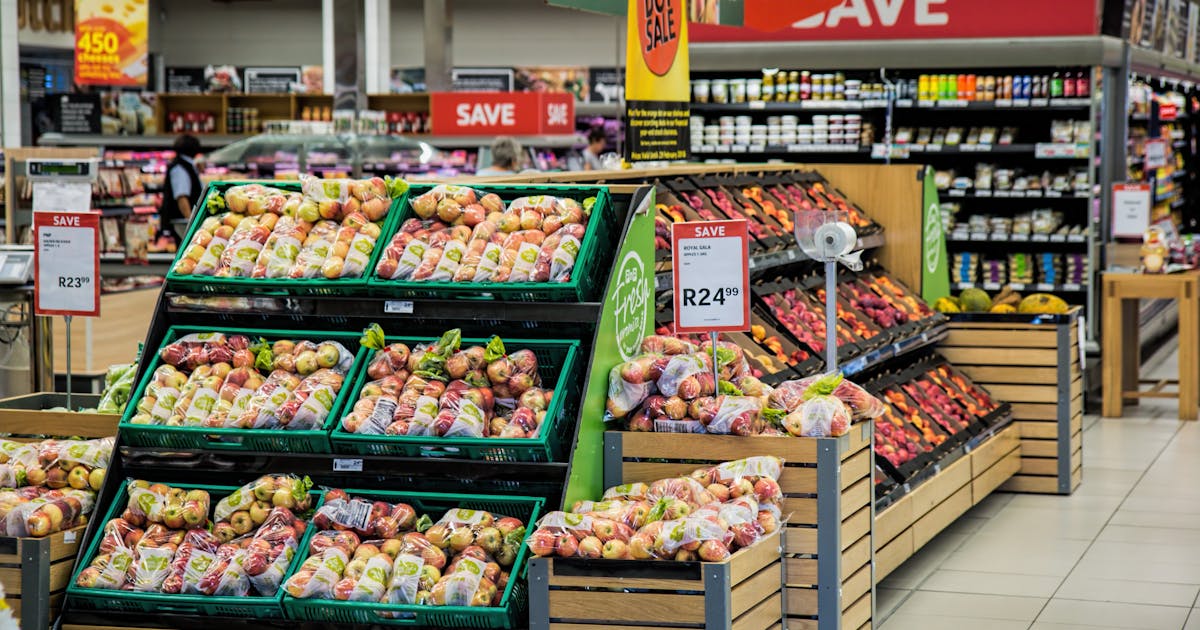 Grocery store produce aisle representing retail market concentration in Canada
