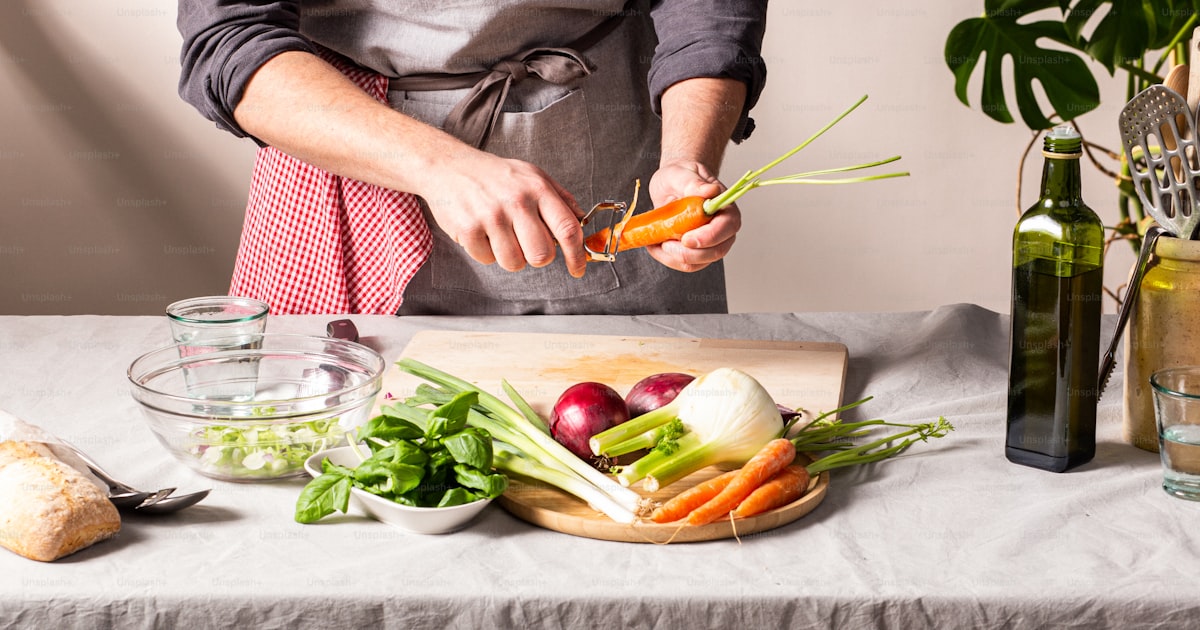 Notebook with a weekly meal plan next to fresh ingredients