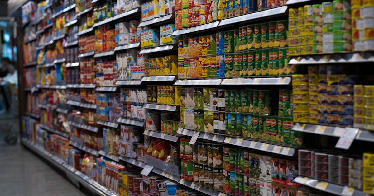 Grocery store shelves with packaged products affected by shrinkflation